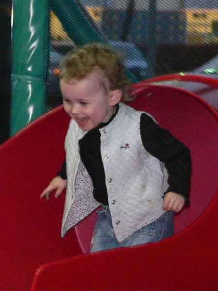 Sydney playing on a slide set