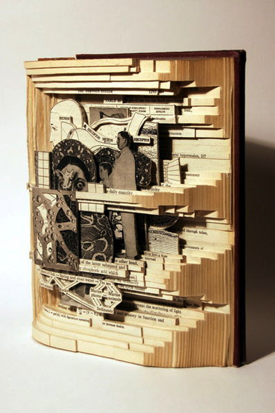 Photo of one of artist Brian Dettmer’s “Book Autopsies,” in which a book is carved to form a new work of art made of revealed images from the book’s pages.