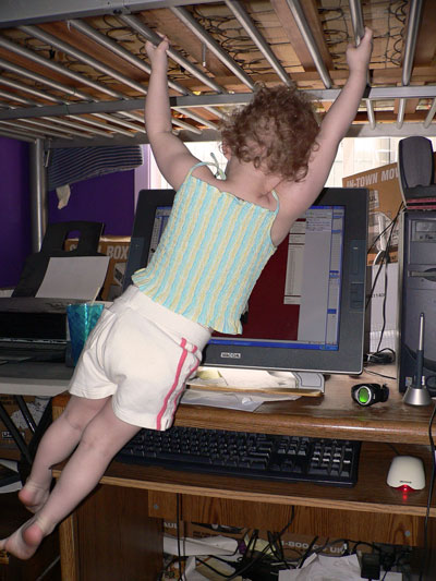 Sydney playing under a bunk bed.