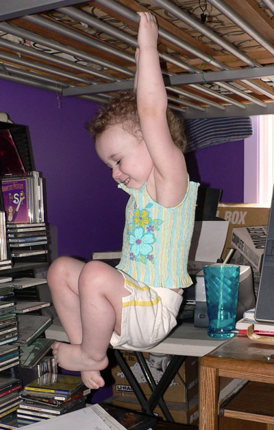 Sydney playing under a bunk bed.