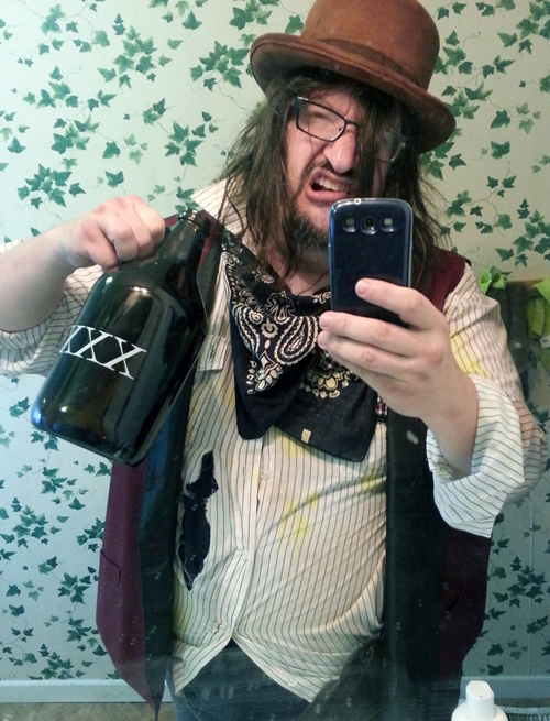 Barry as a town drunk from an old Western taking a selfie